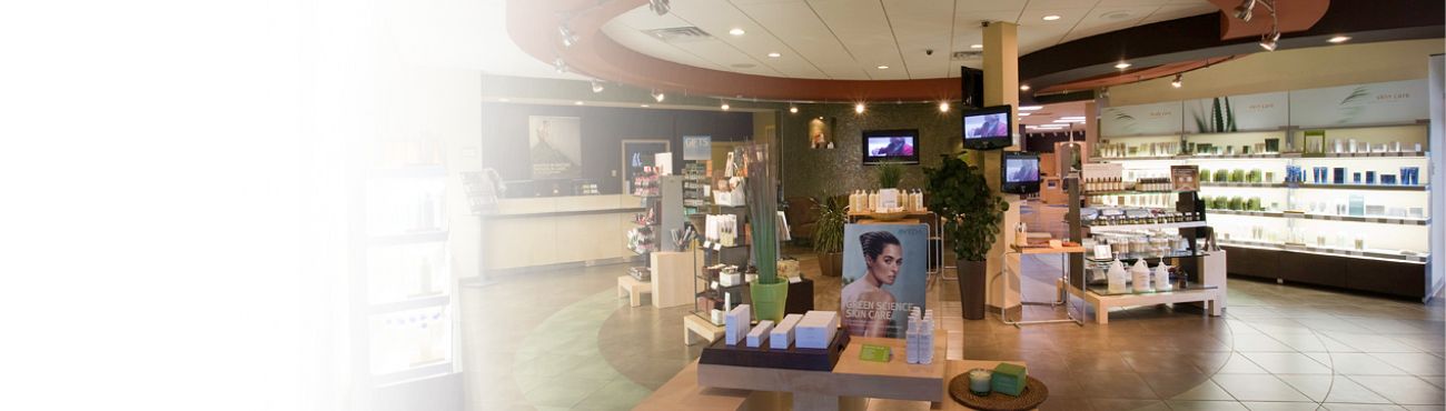 The Kirkwood salon retail floor with Aveda shelving and plants